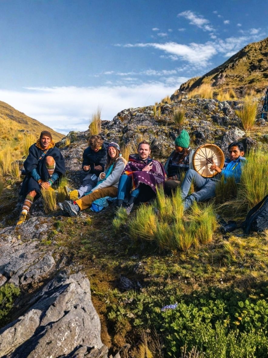 Guests gathered around a fire in the evening